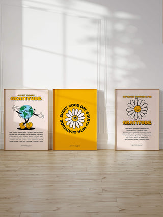 Set of 3 inspiring quote posters in frames resting together against panelled white wall. Free gratitude and motivational art prints.