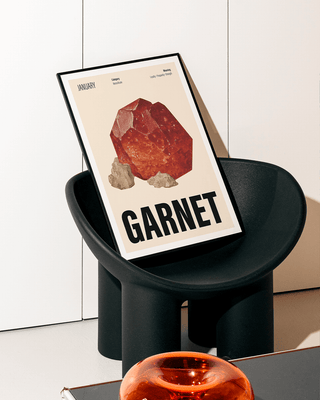 Garnet crystal birthstone wall art print on contemporary black chair.