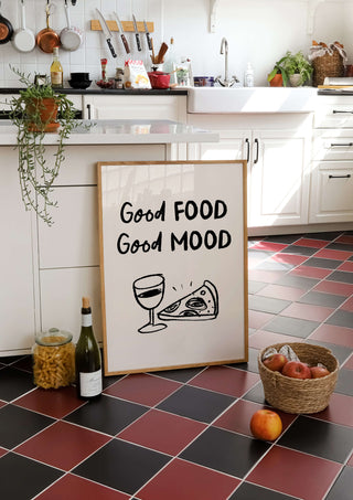 Good Food Good Mood Print. Framed print on kitchen tiled floor. Food and kitchen items are located around the scene