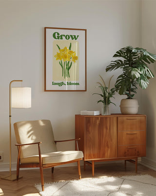 Grow, Laugh, Bloom art print. Featuring hand-drawn watercolour daffodils in retro living room. Supports your personal growth, share laughter, and bloom with confidence. Hopecore, uplifting positive feel-good art prints. Hand painted spring flowers wall art in oak frame