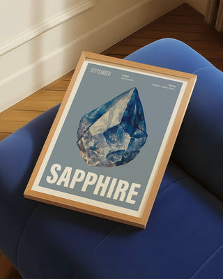 September birthstone sapphire crystal wall art print on blue velvet sofa.
