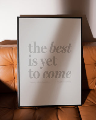 The Best Is Yet To Come framed Print - Black framed print sitting on tan leather sofa