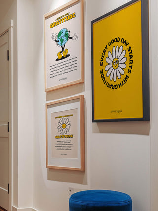 Set of 3 free motivational gratitude meditation art posters framed making up gallery wall in hallway.