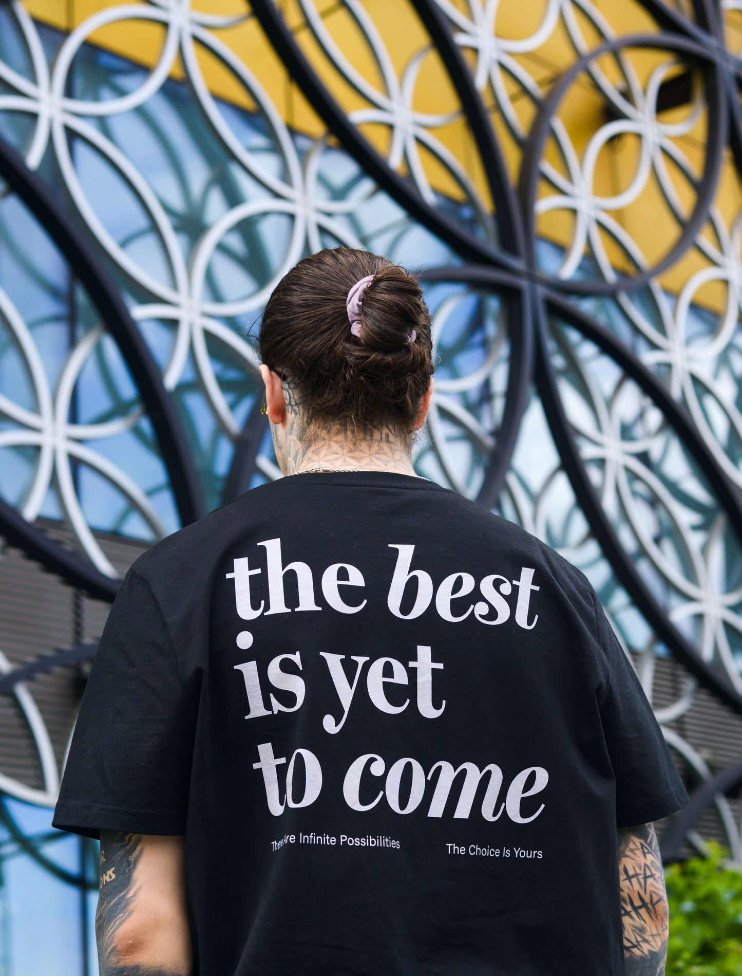 The best is yet to come t-shirt. positive messaging mental health tee. black and grey. Male model at Birmingham Library