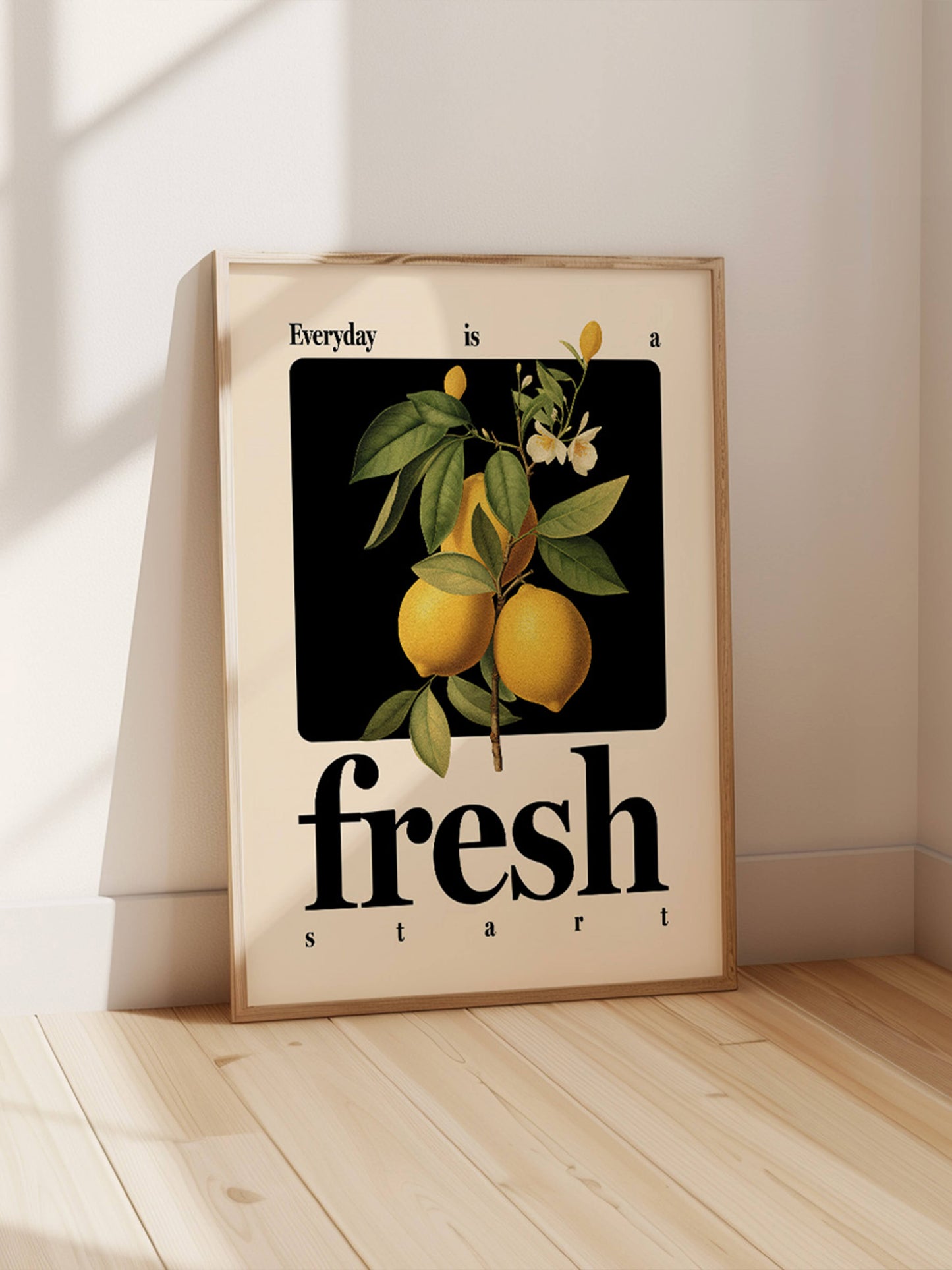 "Everyday is a fresh start" motivational artwork print, framed leaning against white wall on wooden floor.