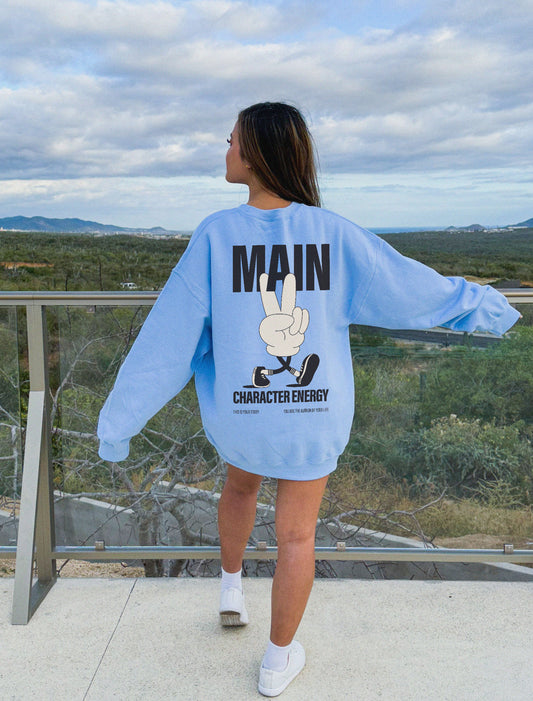 Model wearing oversized main character energy sweater in blue