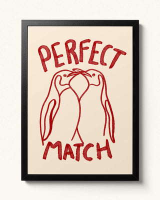 Hand-drawn perfect match penguin wall art in a black frame. Cream background with cherry red watercolour colours. Perfect unique gift. 