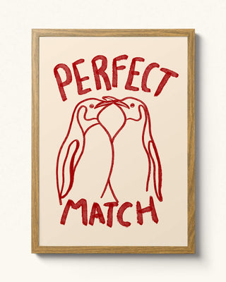 Hand-drawn perfect match penguin wall art in a oak frame. Cream background with cherry red watercolour colours. Perfect unique gift. 