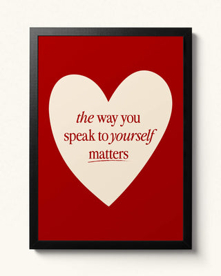 Positive self talk, just be yourself art print in cherry red. Uplifting home decor gift. Hand drawn heart the way you speak to yourself matters wall art black framed.