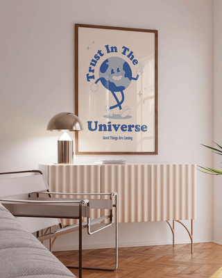 Affirmation art print that reads trust in the universe. Retro style with a hand-drawn planet character. Mental health prints with positive quote.