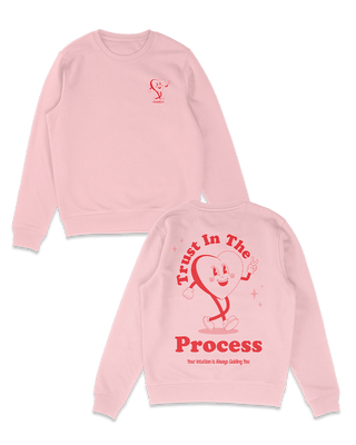 Pink sweater with red design that reads trust in the process. Mindfulness, wellness clothing