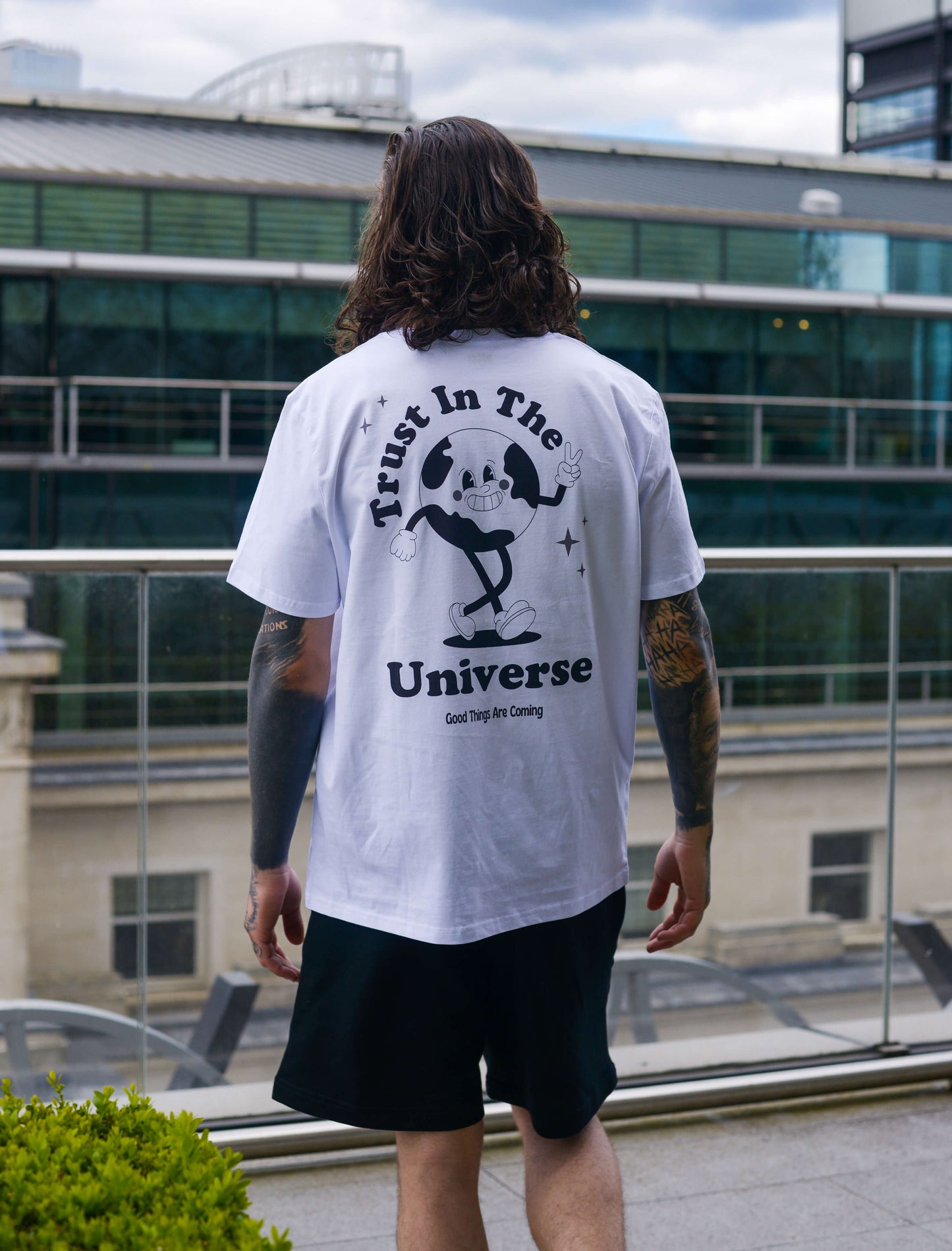 Trust in the universe tee, positive t-shirt, affirmation clothing, streetwear, unisex clothing. Man with tattoos 