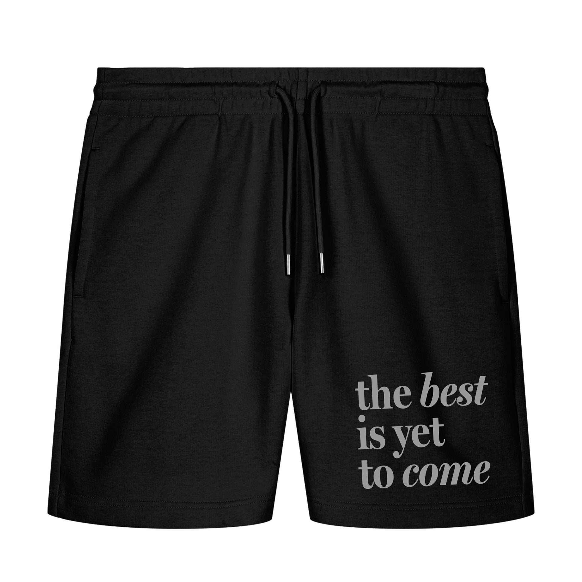 The best is yet to come shorts. positive messaging mental health shorts. Front shot of shorts with grey positive affirmation print on white background 