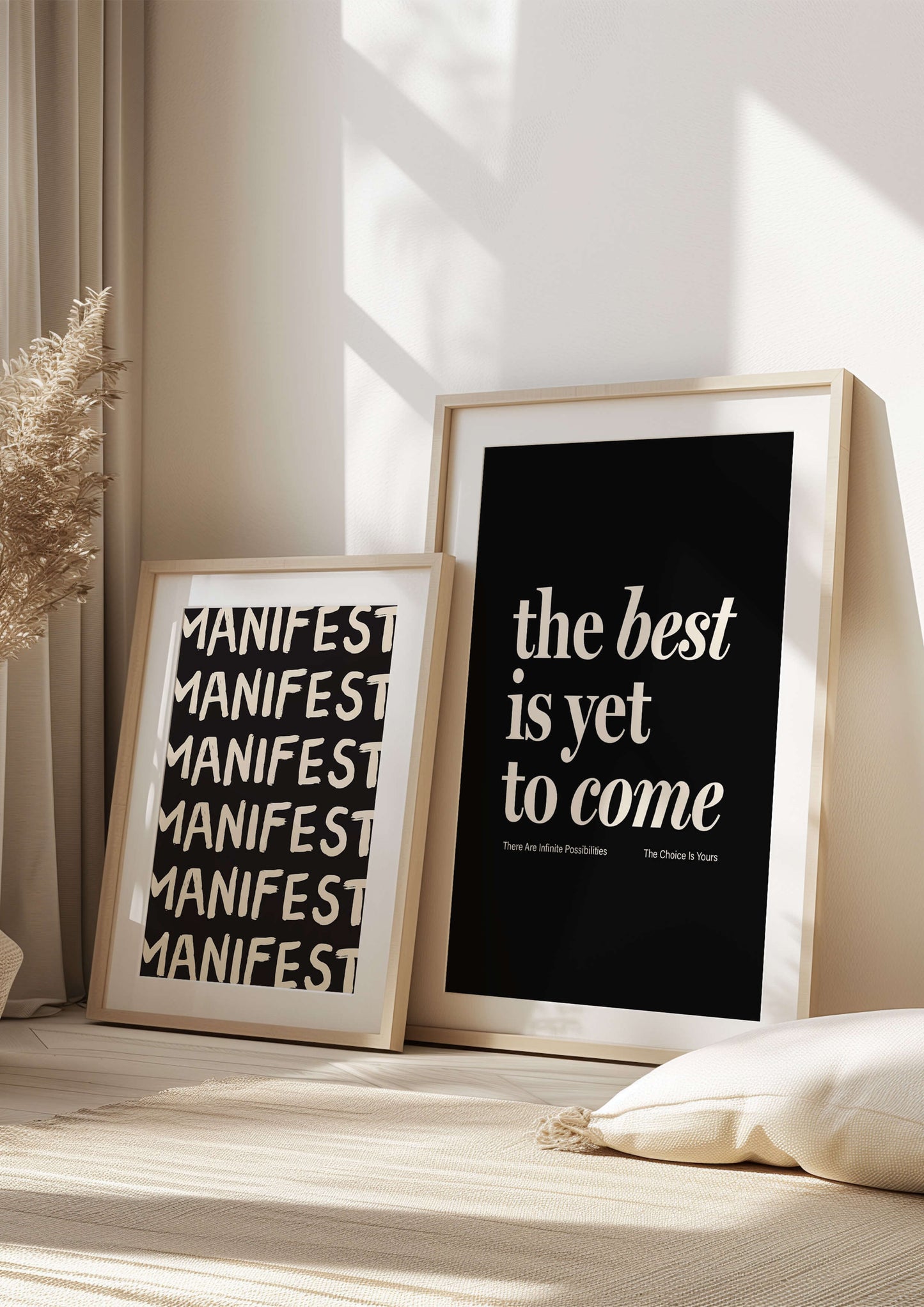 Print reading "the best is yet to come" in black. affirmation print manifestation print mental health prints positive quote print. Two positive prints together leaning against a white wall. the other print says "manifest"