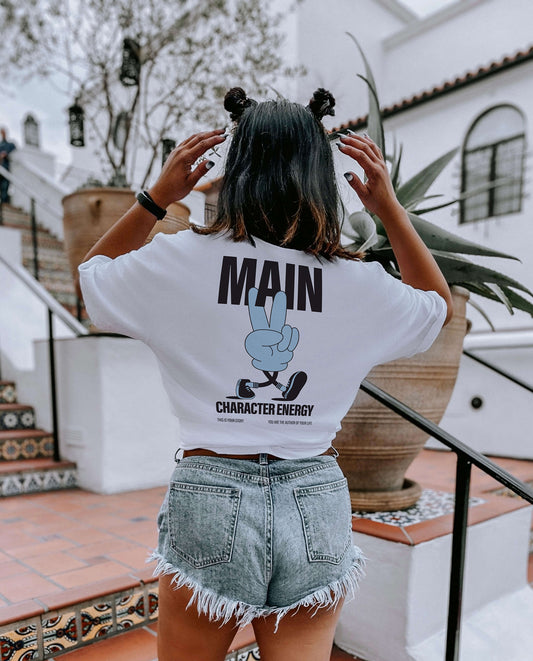 Woman wearing Main character energy tee in blue